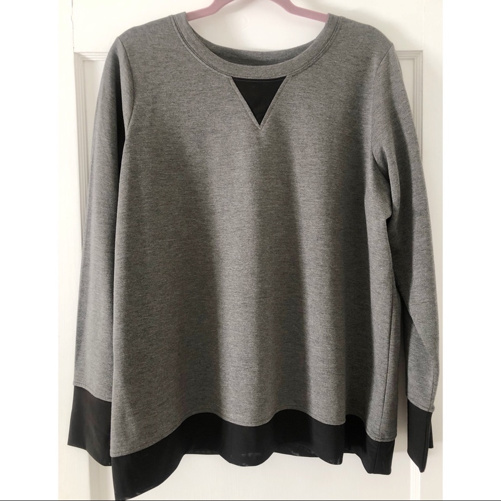 Sweater with mesh paneling